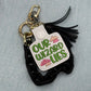 Our Wizard Lies pink clouds keychain